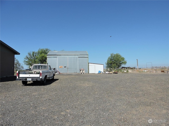 1402 Adams Rd N, Quincy, WA 98848 - view of parking featuring an outbuilding