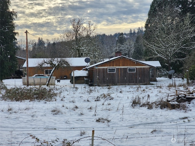 view of snow covered house