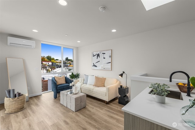 living room with light wood-type flooring and a wall mounted AC