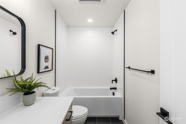 full bathroom with tile patterned flooring, vanity, toilet, and tiled shower / bath