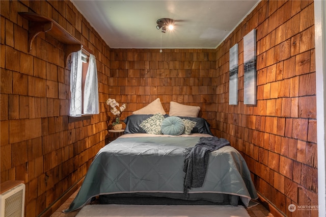 bedroom with wooden walls