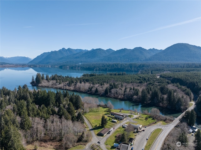 aerial view featuring a water and mountain view