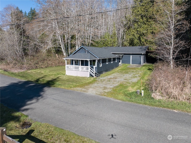 view of front of home with a porch and a front yard