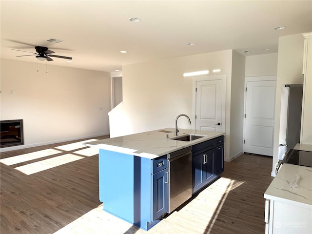 kitchen with ceiling fan, sink, dark hardwood / wood-style flooring, a kitchen island with sink, and appliances with stainless steel finishes