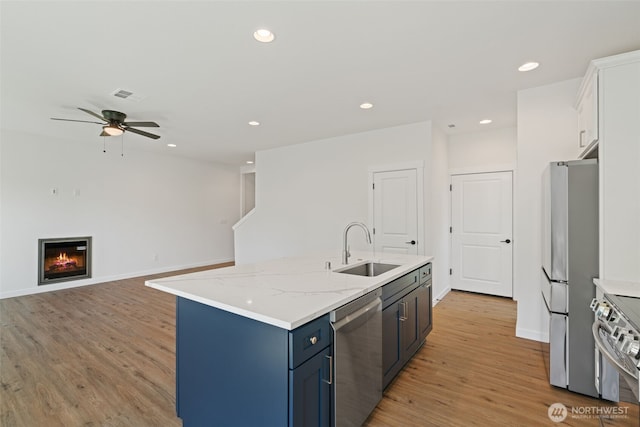 11114 NE 91st Ave, Vancouver, WA 98662 - kitchen with visible vents, appliances with stainless steel finishes, a sink, light wood-type flooring, and a ceiling fan