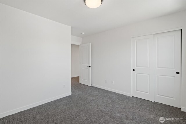 11114 NE 91st Ave, Vancouver, WA 98662 - unfurnished bedroom with dark colored carpet, a closet, and baseboards