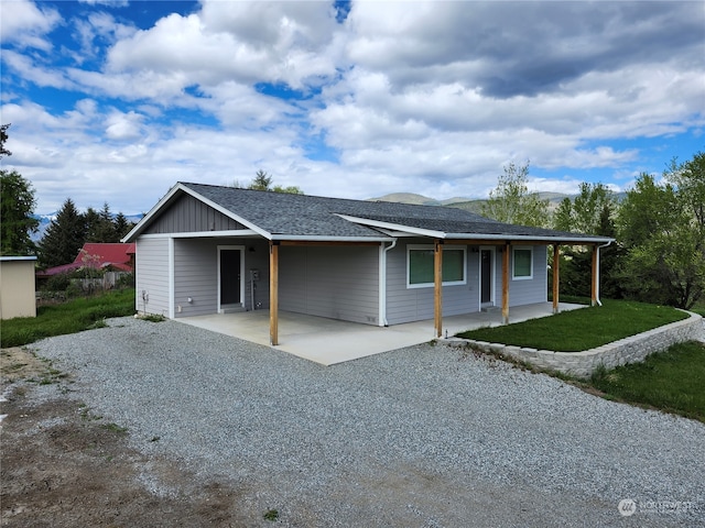 ranch-style home with a front lawn