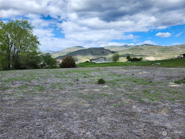 property view of mountains featuring a rural view