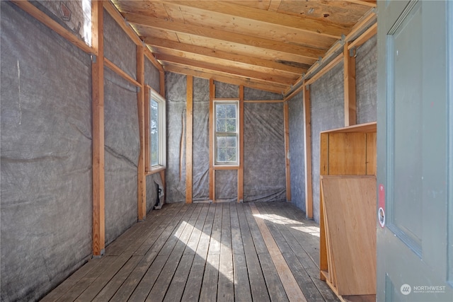 misc room with vaulted ceiling and dark hardwood / wood-style flooring