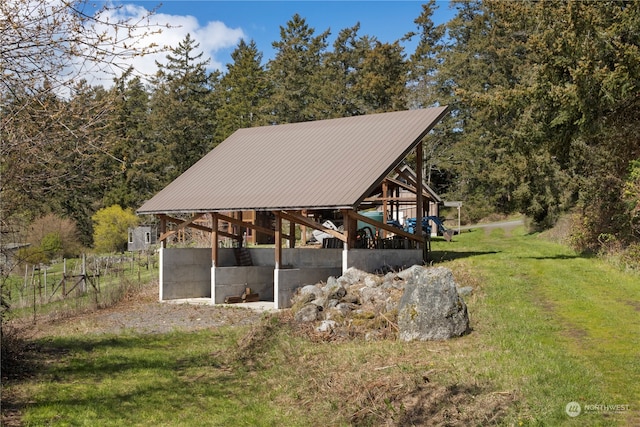 exterior space featuring a yard and an outdoor structure