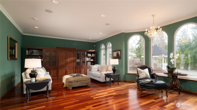 living area with a notable chandelier, ornamental molding, and dark hardwood / wood-style floors