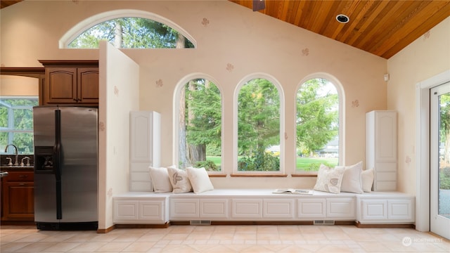 interior space featuring high vaulted ceiling, sink, wood ceiling, and light tile flooring