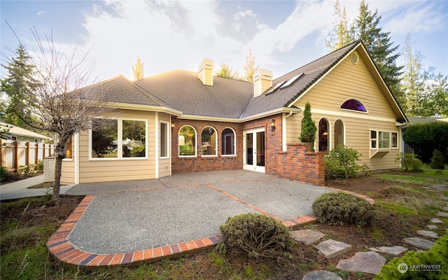 rear view of property featuring a patio area