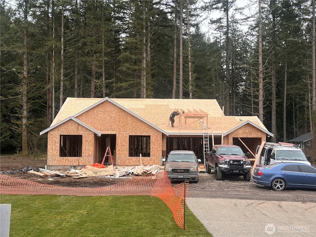 property under construction with a front lawn