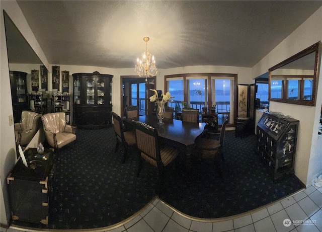 tiled dining area featuring a chandelier and a healthy amount of sunlight