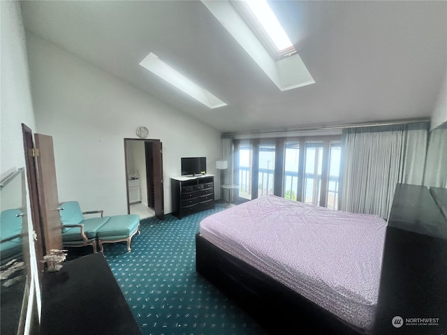 bedroom with vaulted ceiling with skylight and dark carpet