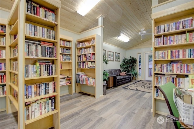 sitting room featuring light hardwood / wood-style flooring, vaulted ceiling, and wooden ceiling