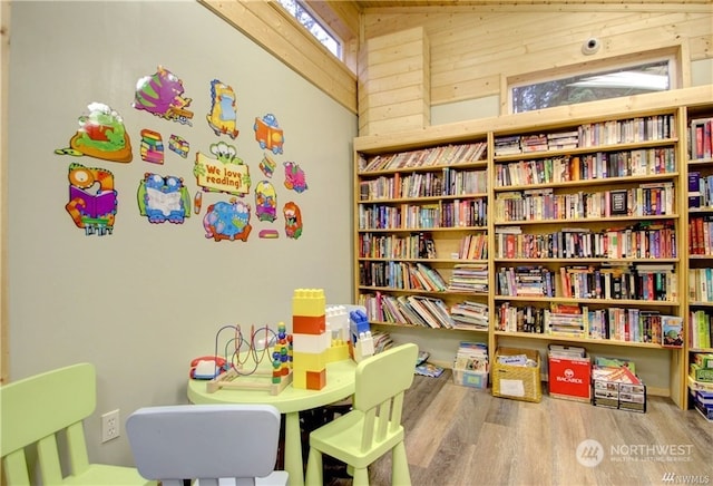 recreation room with hardwood / wood-style floors