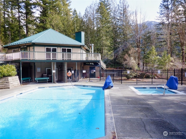 view of swimming pool featuring a patio area