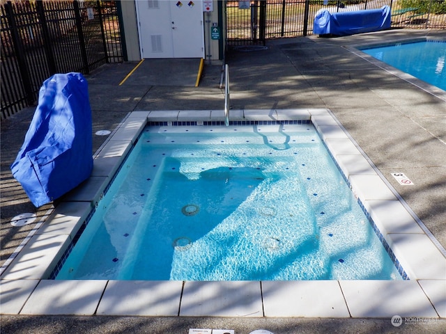 view of pool featuring a patio