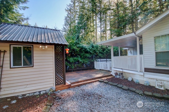 view of side of property featuring a wooden deck