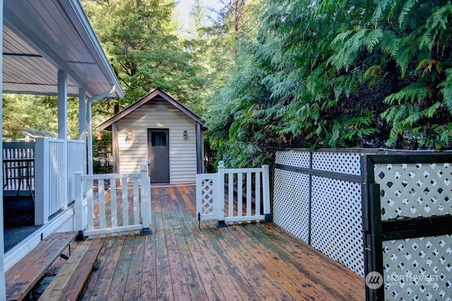 wooden terrace with an outbuilding