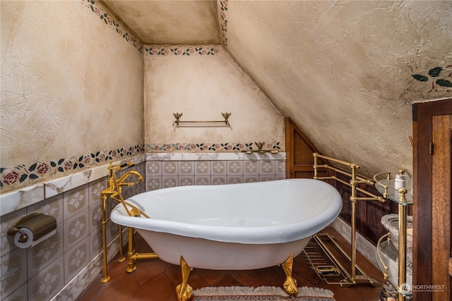 4 Thornewood Ln SW, Lakewood, WA 98498 - bathroom with a tub, vaulted ceiling, and tile flooring