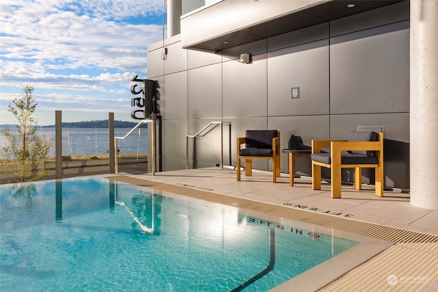 view of swimming pool with a patio area