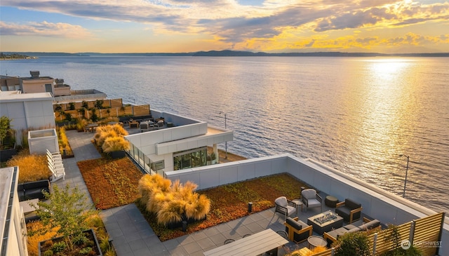 aerial view at dusk with a water view