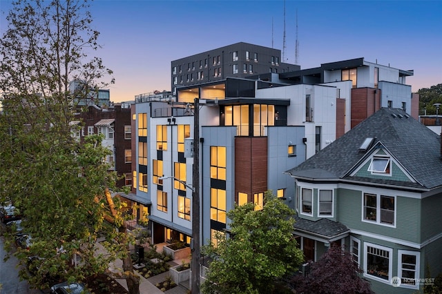 view of outdoor building at dusk