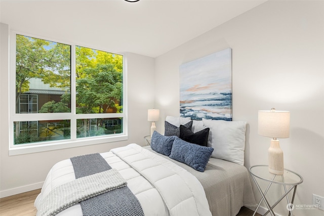 bedroom featuring wood-type flooring