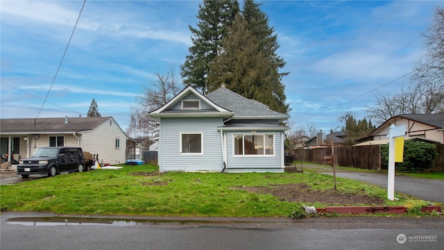 view of front of home with a front lawn