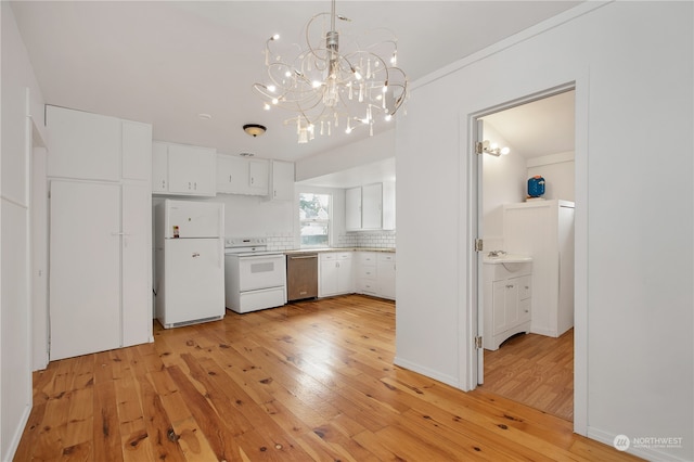 kitchen with light hardwood / wood-style floors, white appliances, white cabinetry, hanging light fixtures, and an inviting chandelier