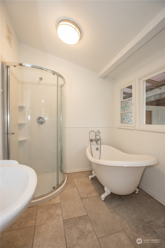 bathroom featuring an enclosed shower and tile floors