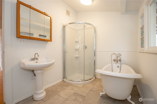 bathroom featuring walk in shower and tile floors