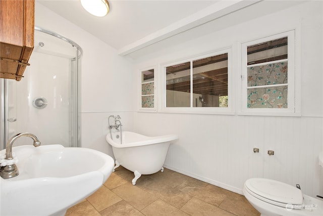 bathroom featuring tile flooring, sink, and toilet