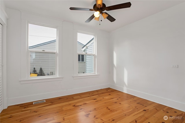 empty room featuring ceiling fan and light wood-type flooring