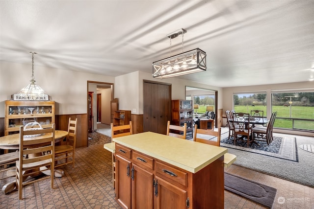 kitchen with a center island, pendant lighting, and a chandelier