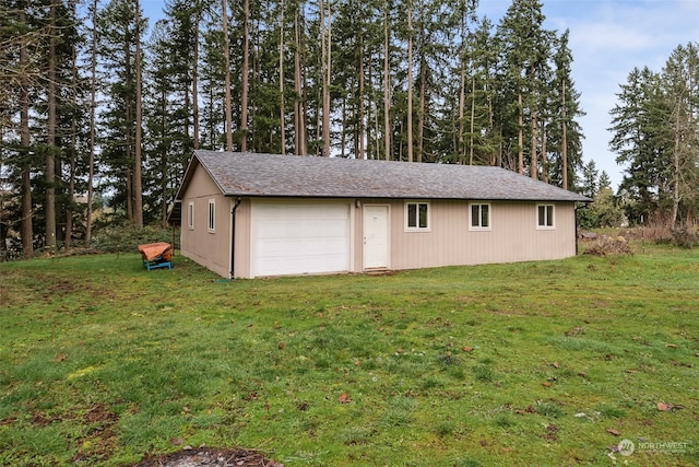 garage with a lawn