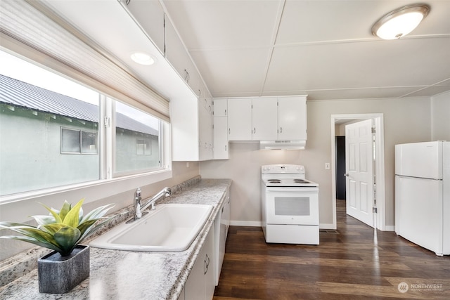 kitchen with white cabinets, white appliances, sink, and dark hardwood / wood-style floors