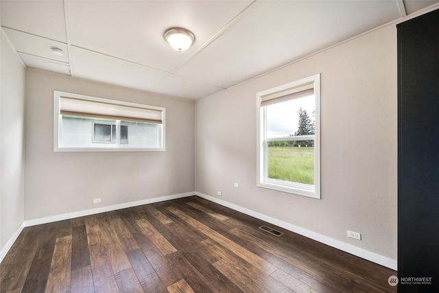 empty room with wood-type flooring