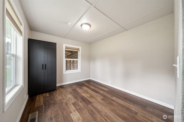 unfurnished bedroom with hardwood / wood-style flooring