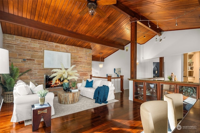 living room featuring beamed ceiling, ceiling fan, dark hardwood / wood-style floors, and wood ceiling