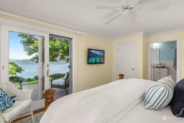 bedroom featuring ensuite bathroom, a water view, access to exterior, hardwood / wood-style flooring, and ornamental molding