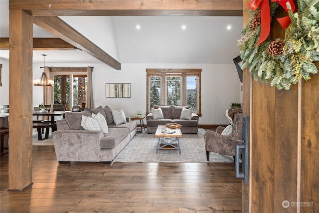 living area featuring vaulted ceiling with beams, a notable chandelier, plenty of natural light, and hardwood / wood-style flooring