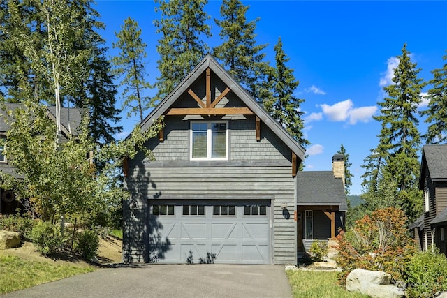 view of front of property featuring driveway and a garage