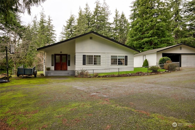 view of front facade featuring a front lawn and a garage