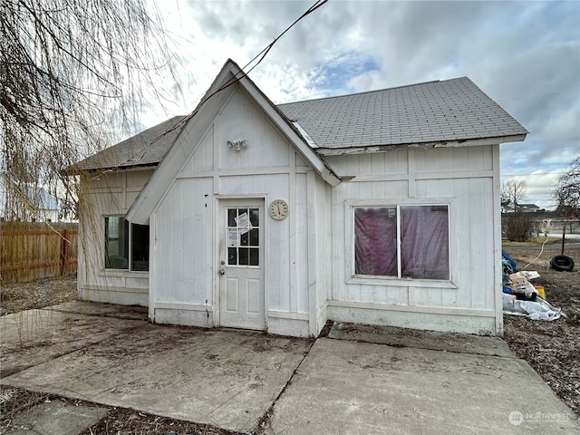 back of house featuring an outdoor structure and a patio