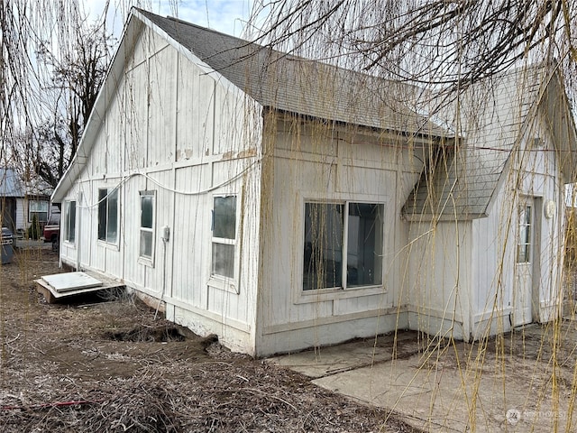 view of property exterior with a patio area