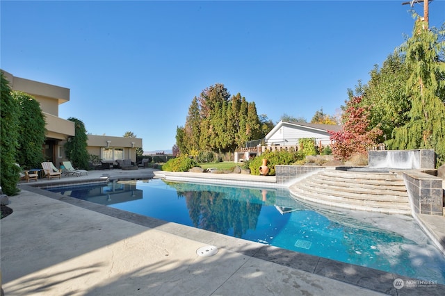 view of swimming pool featuring a patio